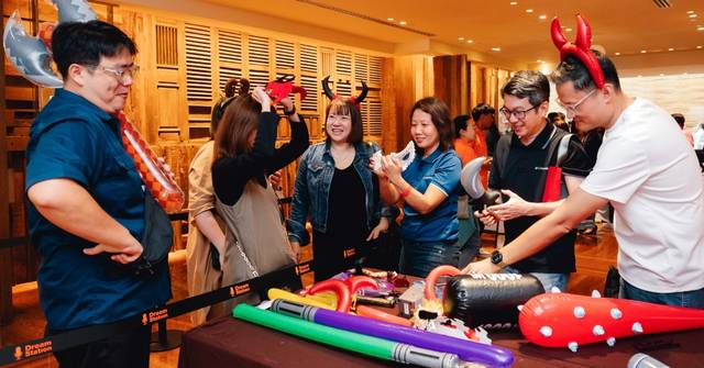 Participants is wearing the props for their group photobooth moment