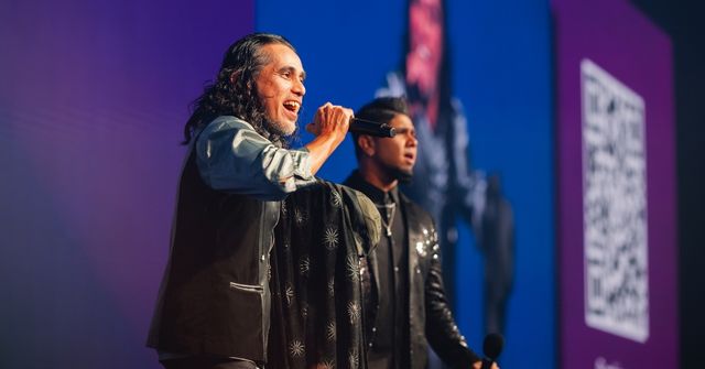 A singer is performing at a corporate dinner and dance