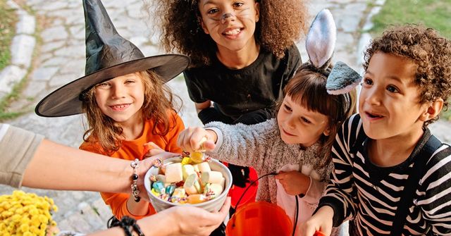 Kids are doing treat-or-trick tradition at a family