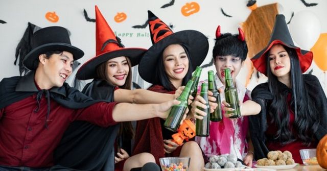 Halloween party attendees dress up as witches and wizards