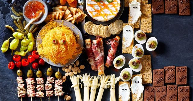 A disply of a charcuterie board at a Halloween party