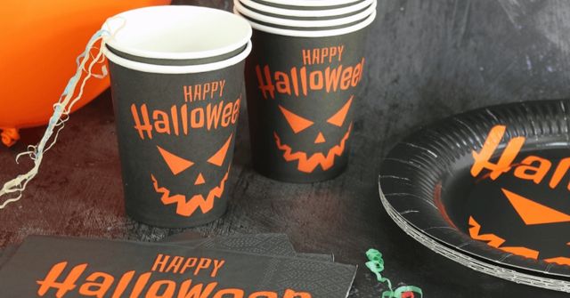 Sets of Halloween-themed paper cups and plates for parties