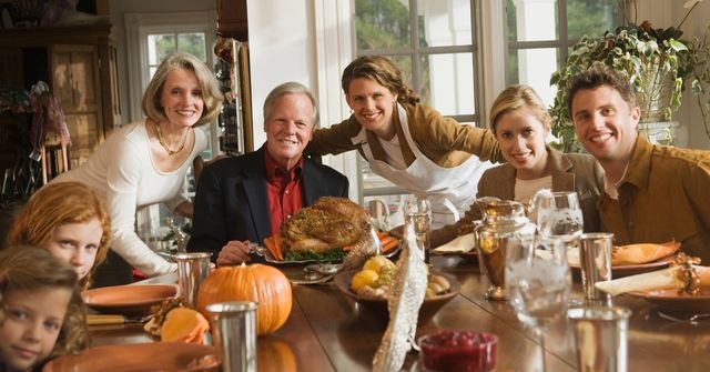 A family is enjoying their Thanksgiving dinner