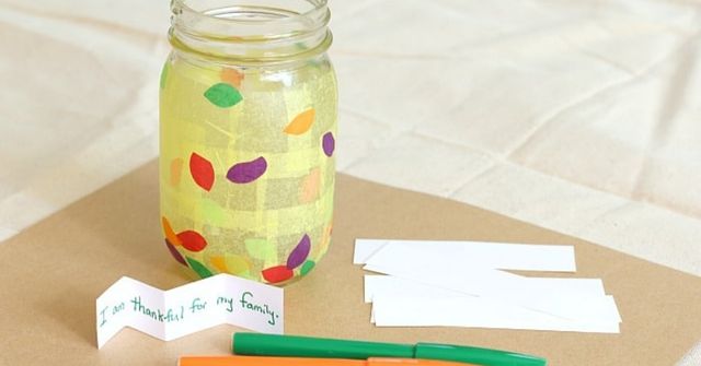 Jar, pens and pencils for the Thanksgiving Gratitude Jar game