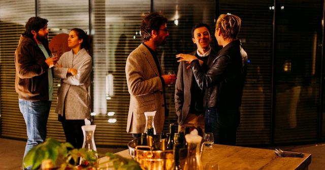 Participants mingle before the Thanksgiving dinner starts