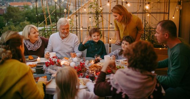 A child shares his gratitude during a Thanksgiving dinner with his family