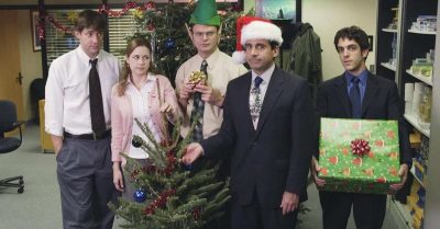 5 office coworkers looking unamused at the company Christmas party 