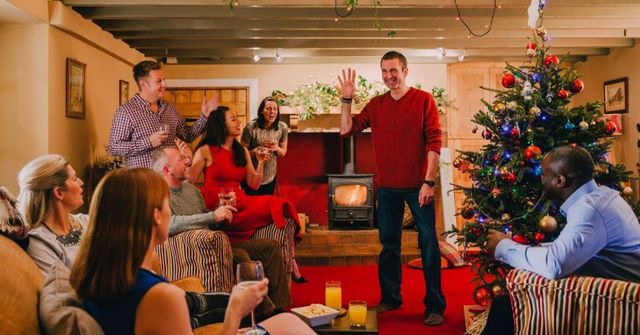 A group of employees participates work Christmas party games happily