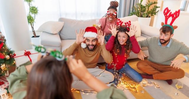 A team during their turn in the work Christmas Charades game 