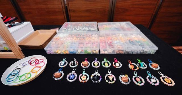 A display of colorful beaded keychains at Dream Sation's keychain workshop