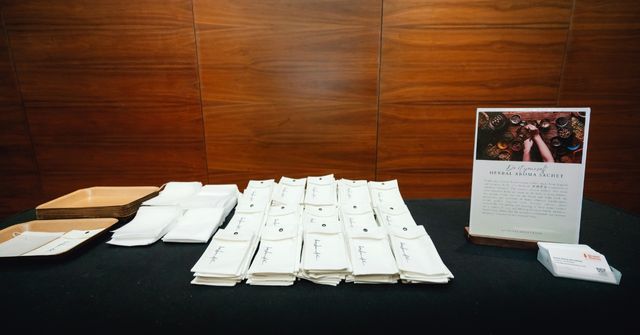 Our equipment table setup for the herbal sachet workshop, including sachet bags, bamboo trays, and printed instruction