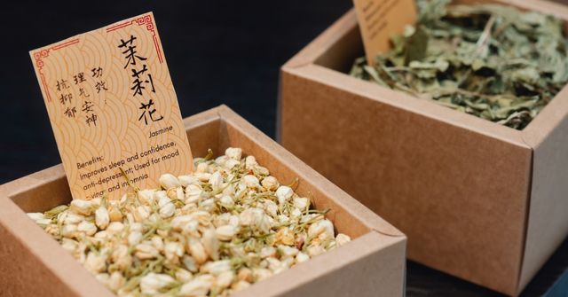 A closeup at our dried herbs containers with labels, conveying detailed benefits of each herb