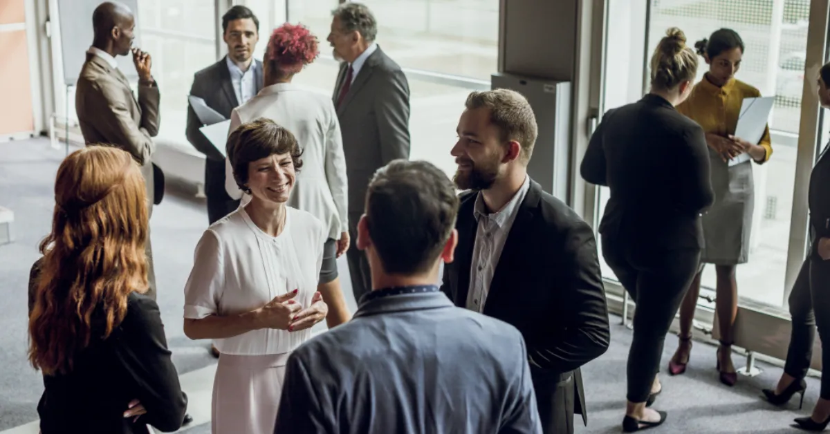 Groups of professionals during the “common gound hunt” icebreaker game