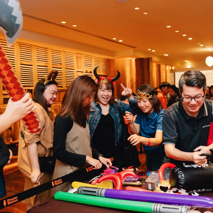 Participants happily picking props for their photobooth activity